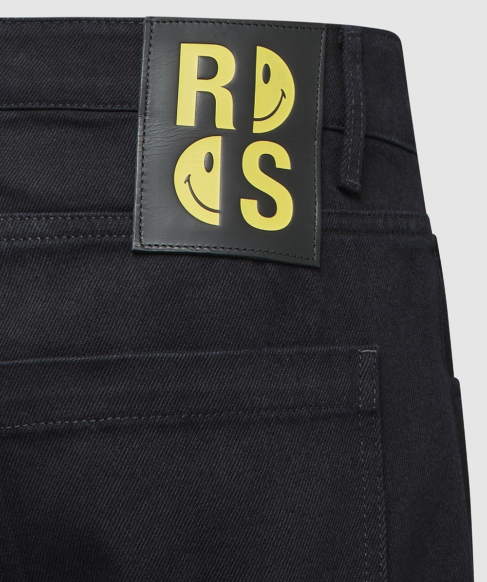 RAF SIMONS Logo-patch slim-leg jeans