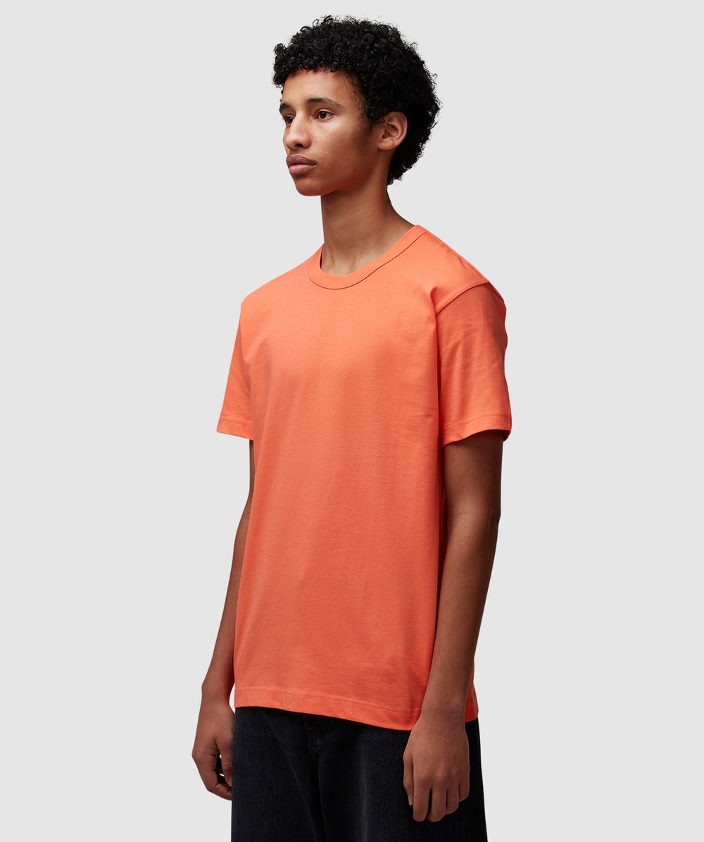Tシャツ・カットソー COMME DES GARCONS Men T-shirt Peach FOT501 PEACH Comme des Garçons PLAY Metal Stone Heart Tee in White/Red