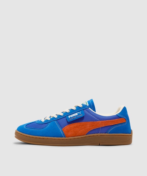 Shop Puma Super Team Handy Sneaker In Ultra Blue-rickie Orange